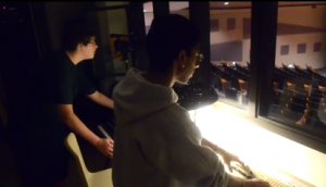 Above: ISP Seniors Ram Patel and Sai Somasundaram, as well as Junior Malachi Loviska, work tirelessly to run the sound booth at IMSA auditorium events, a service that increases in its utility purely because their work cannot be posted online without the heathen practice of metaphotography.