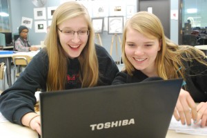 Becca (L) and Marissa (R) mull over notes from their 'Humans of IMSA' meeting.