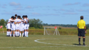 The team huddles before their game against Parkview Christian, which they would go on to win 7-0.